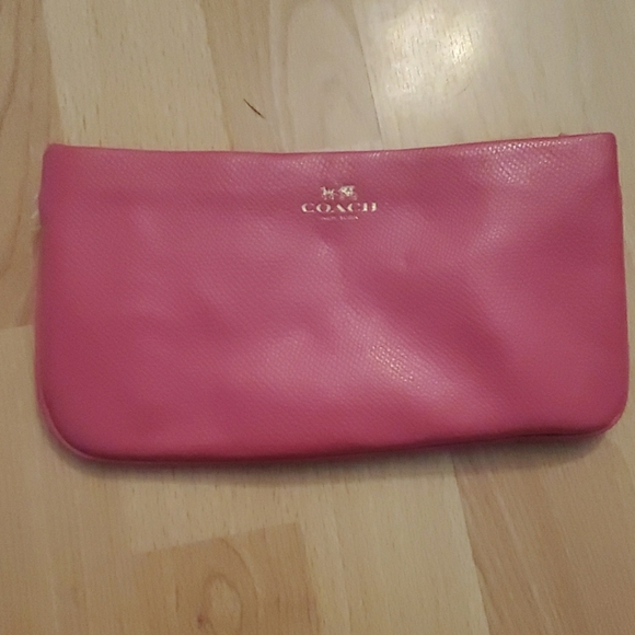 pink coach clutch